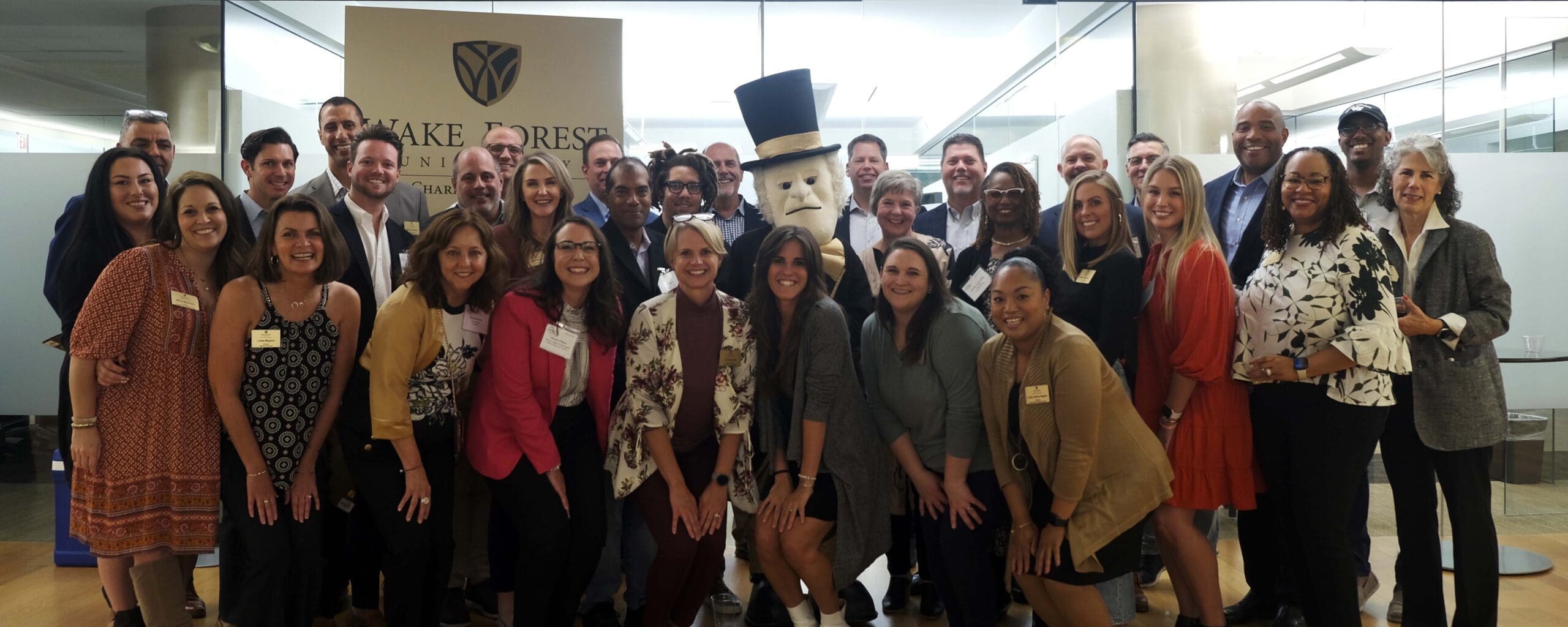 Group picture at Wake360 of students, staff, faculty, and Demon Deac