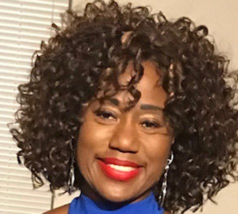 A headshot of Lisa Lucas in a blue shirt