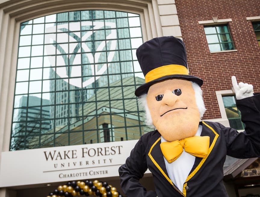 Wake Forest's Demon Deacon mascot in front of the Charlotte campus